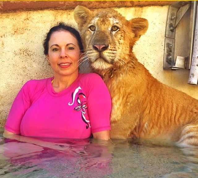 Rajani Ferrante with a liger cub.